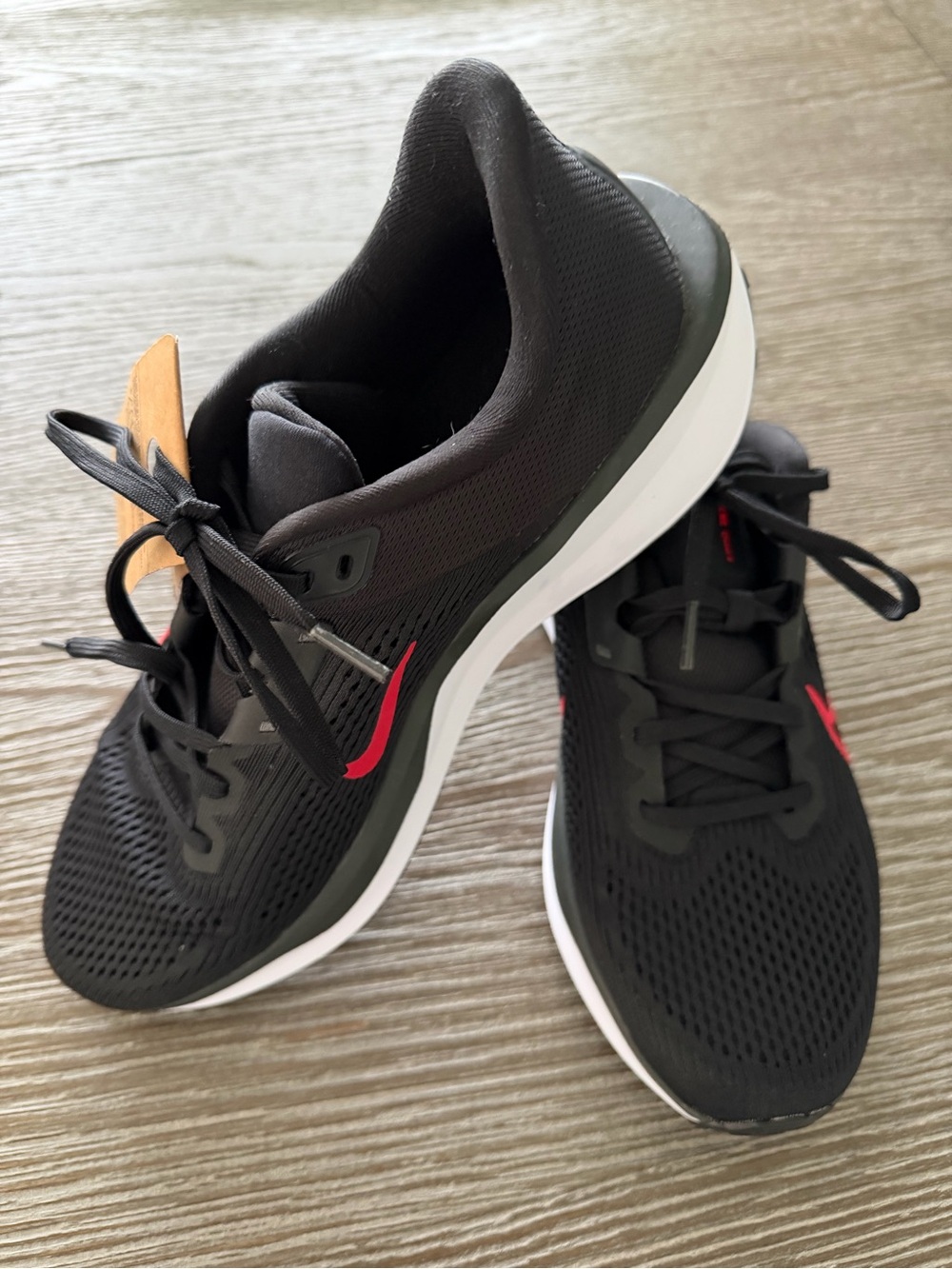 Nike Men’s Black Athletic Shoes with Red Swoosh